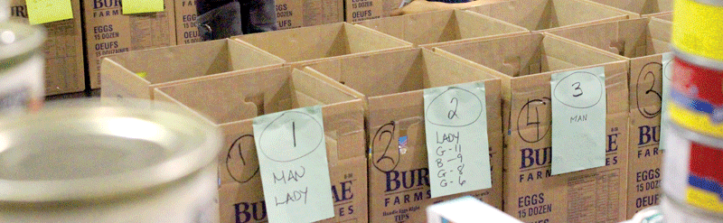 FILE PHOTO Volunteers pack boxes for Christmas for Everyone in 2016