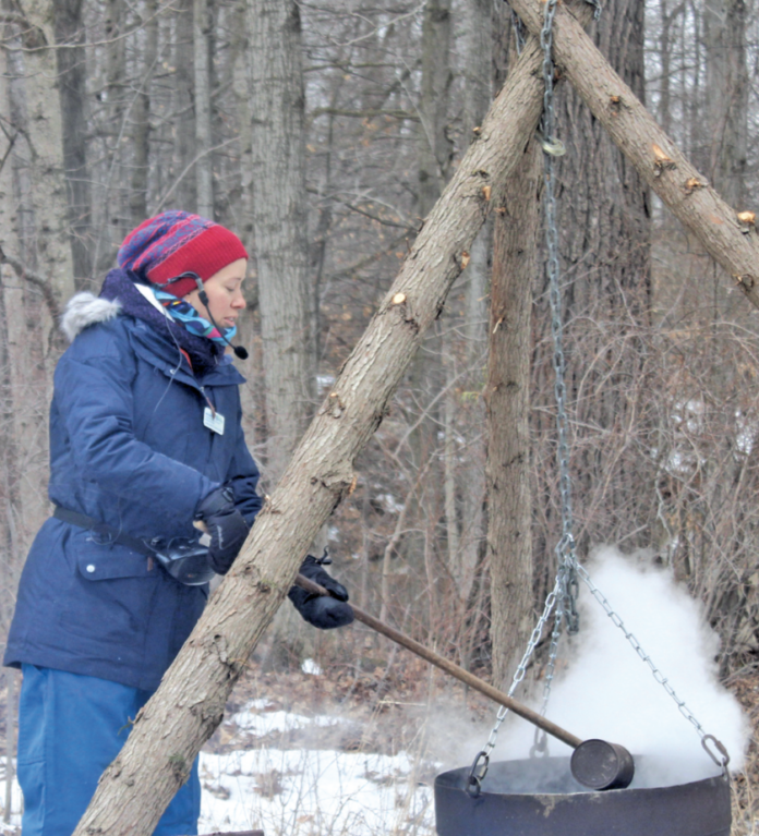 Myra Spiller, a conservation education and community partnership technician with the St. Clair Region Conservation Authority led one of three tours held throughout the day going through the process of tapping a tree, collecting the sap and boiling it to produce the maple syrup.