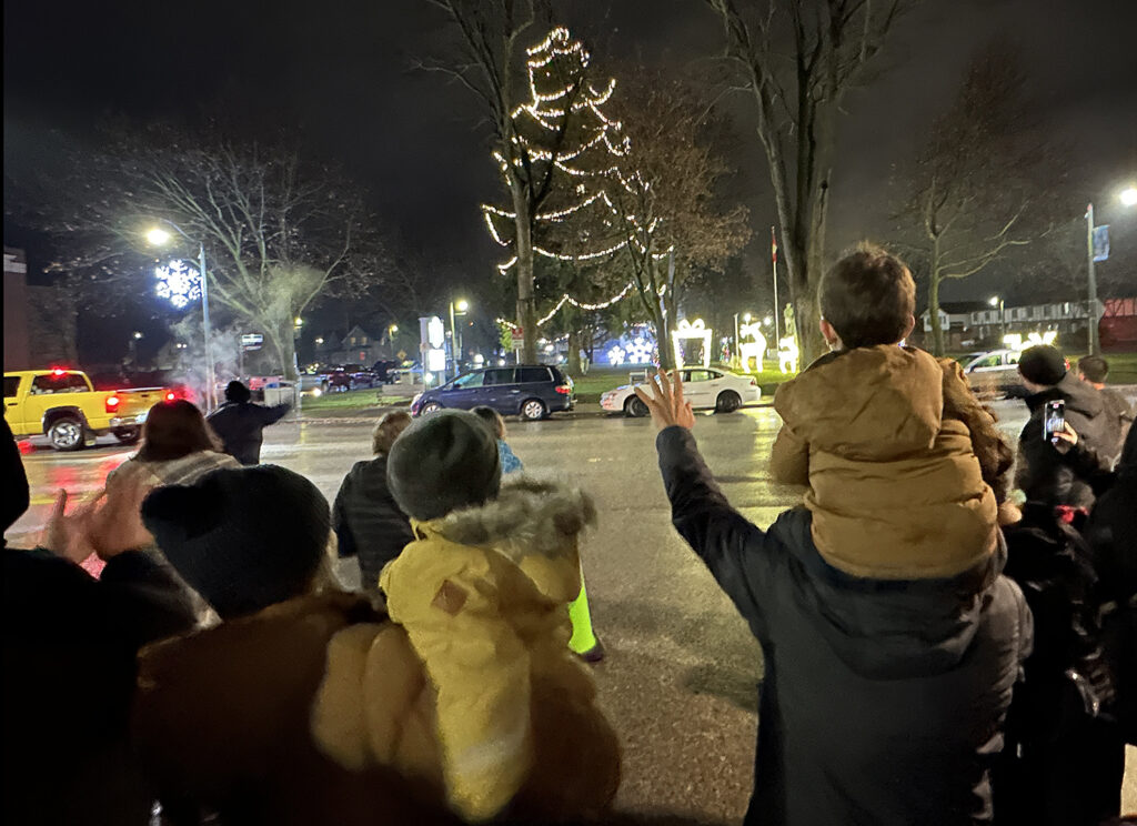 People watch from Fletcher Street as the lights came on in Victoria Park.